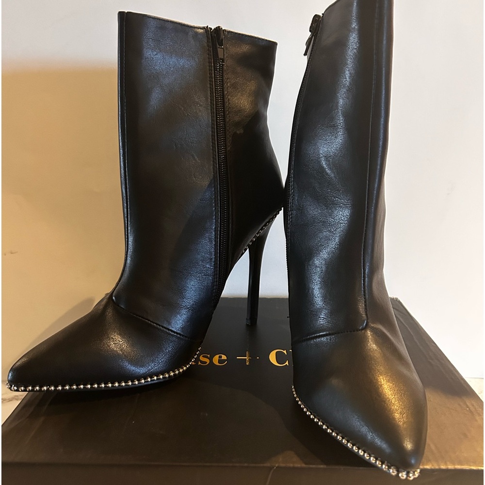 Black with silver stud trim stilleto booties.